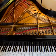[Photo of the inside of a Steinway grand piano]