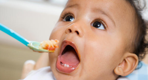 [Photo of a baby eating]