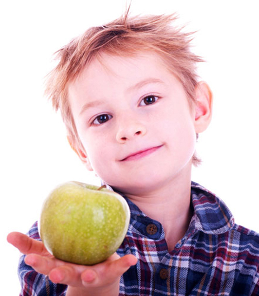 [Photo of a boy holding an apple in his outstretched hand]