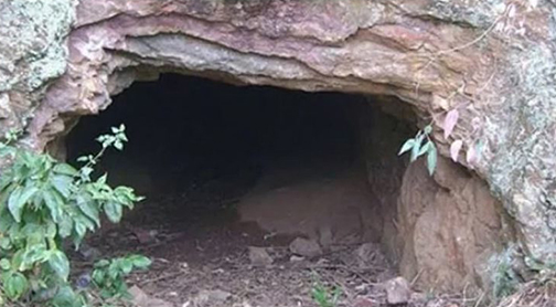 [Photo of the entrance to a cave]