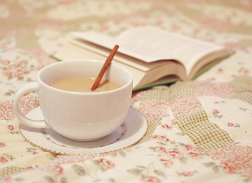 [Photo of a cup and a book]