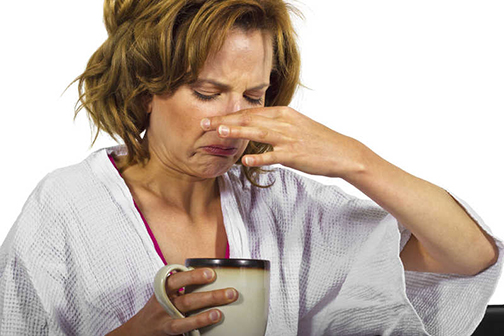 [Photo of woman reacting to bad coffee]
