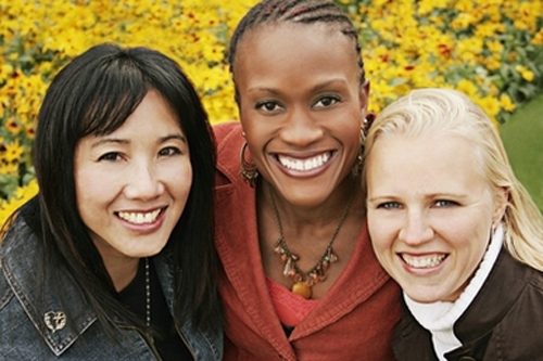 [Photo of three girls of different races]