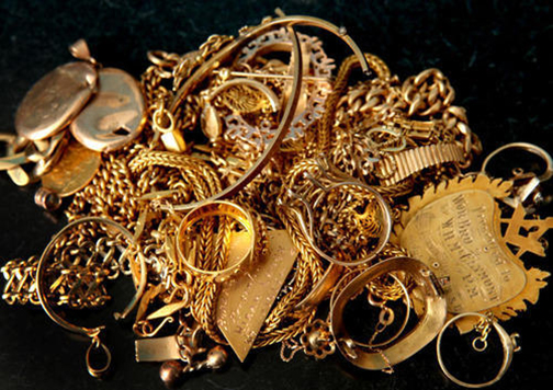 [Photo of gold jewelry in a pile]