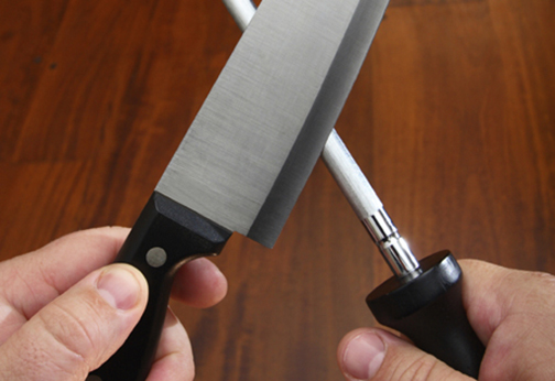 [Photo of sharpening a knife]
