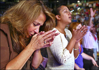 [Photo of women praying]