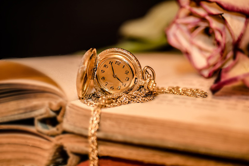 Photo of a watch and a book